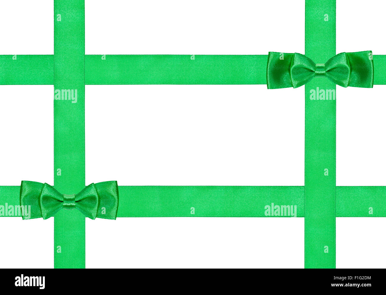 Due piccoli verde doppia nodi di prua su quattro nastri di seta isolati su sfondo bianco Foto Stock