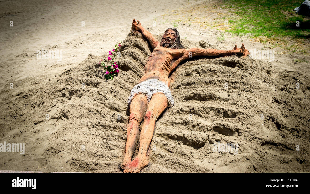 La scultura di sabbia di Gesù su di una spiaggia di Benalmadena spagna Foto Stock