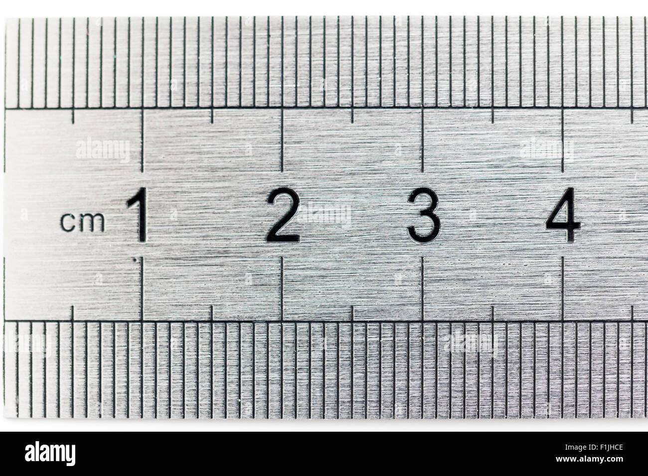 I righelli. In acciaio spazzolato che mostra righello 1-4 cm di intervallo  e misurare la scala. Close up Foto stock - Alamy