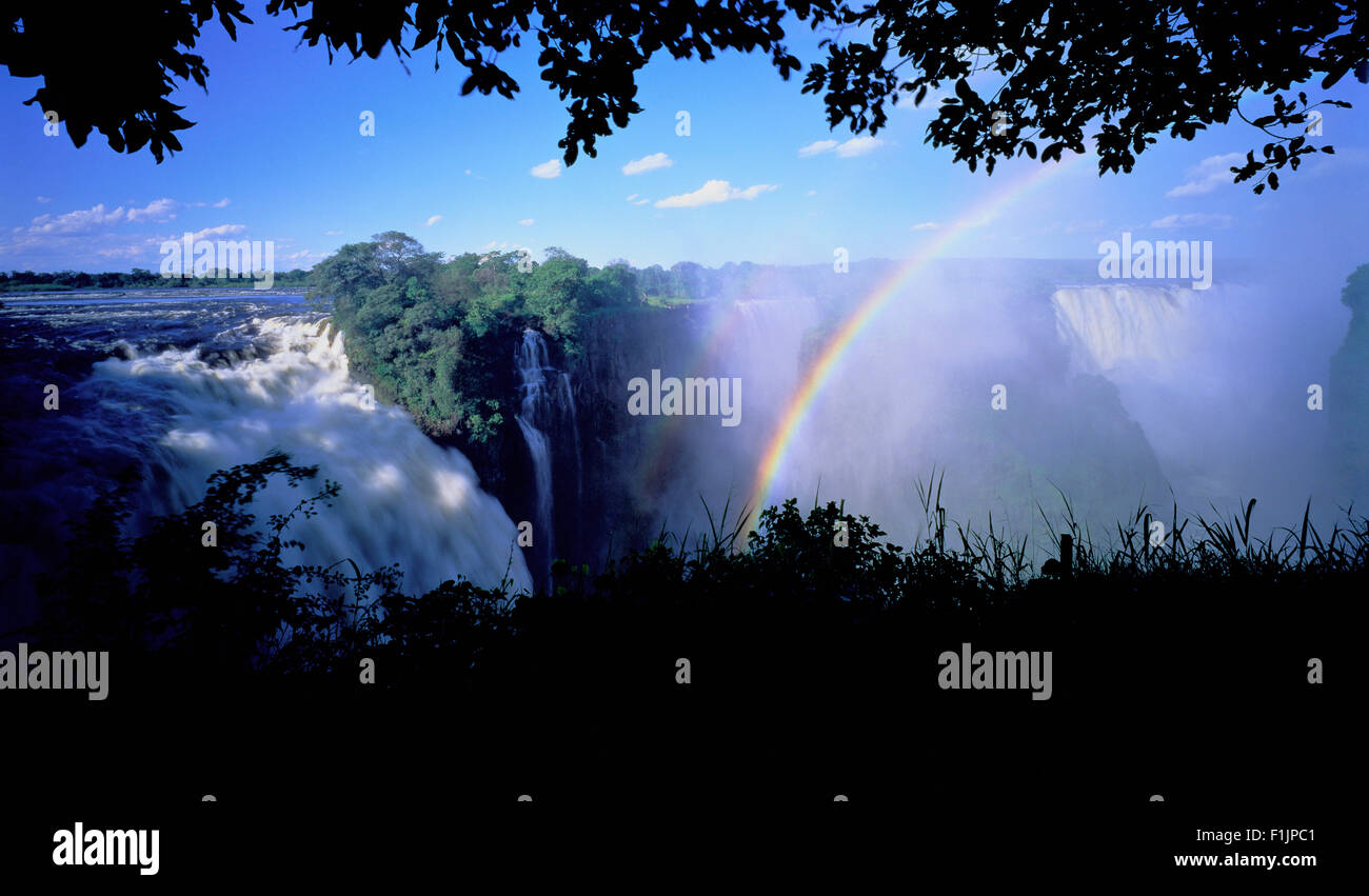 Rainbow su Victoria Falls Zambezi River, Zimbabwe Foto Stock