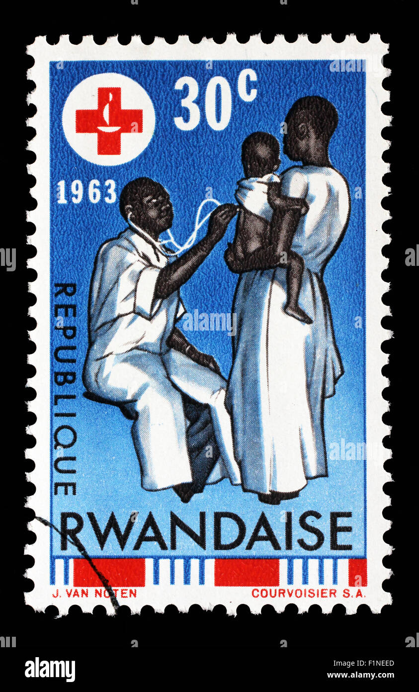 Timbro stampato in Ruanda è dedicato al centenario della Croce Rossa Internazionale, circa 1963 Foto Stock