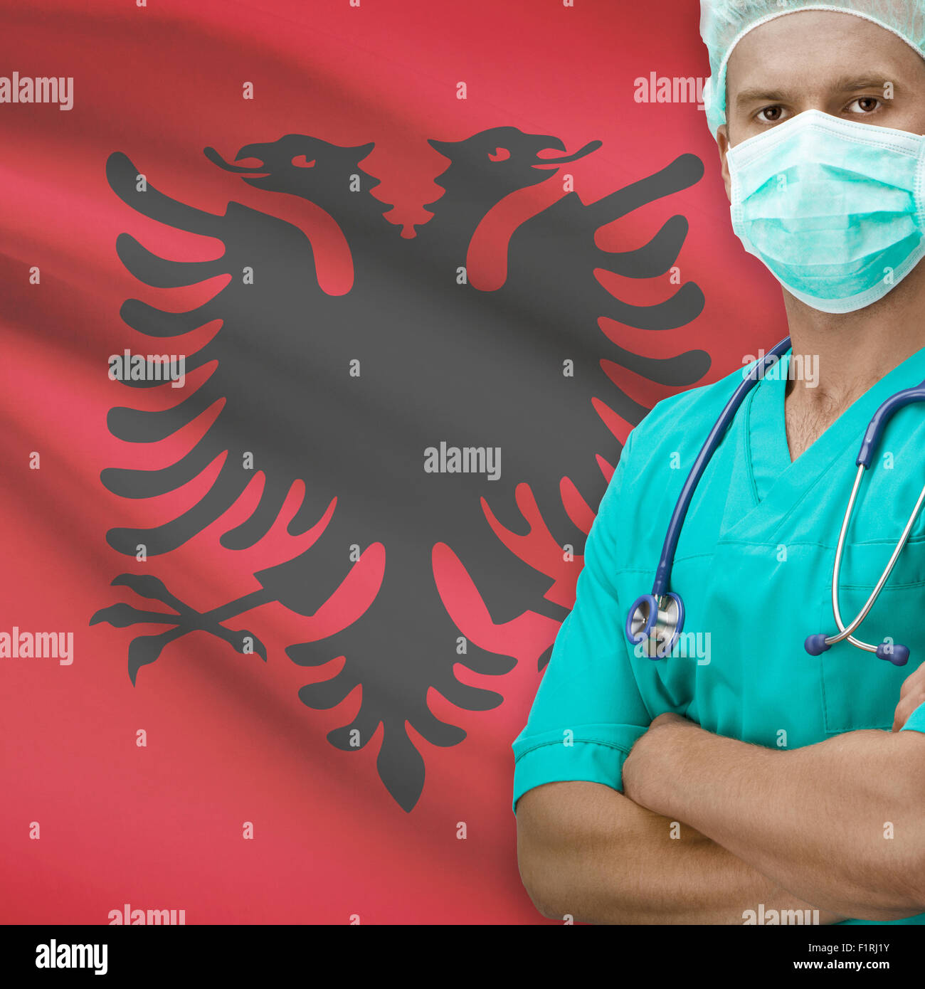 Chirurgo con bandiera su sfondo - Albania Foto stock - Alamy