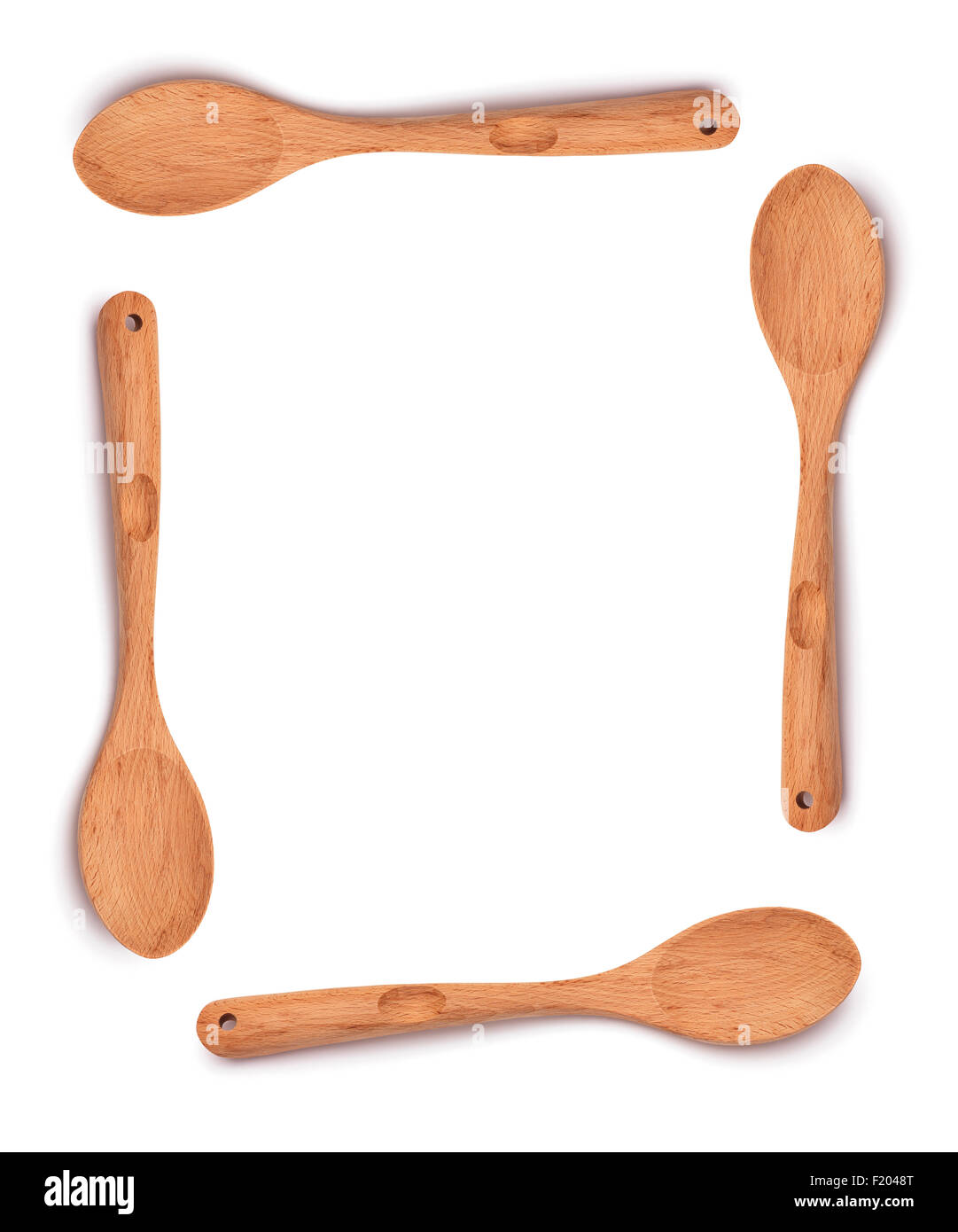 Cucchiaio di legno isolato su sfondo bianco Foto Stock