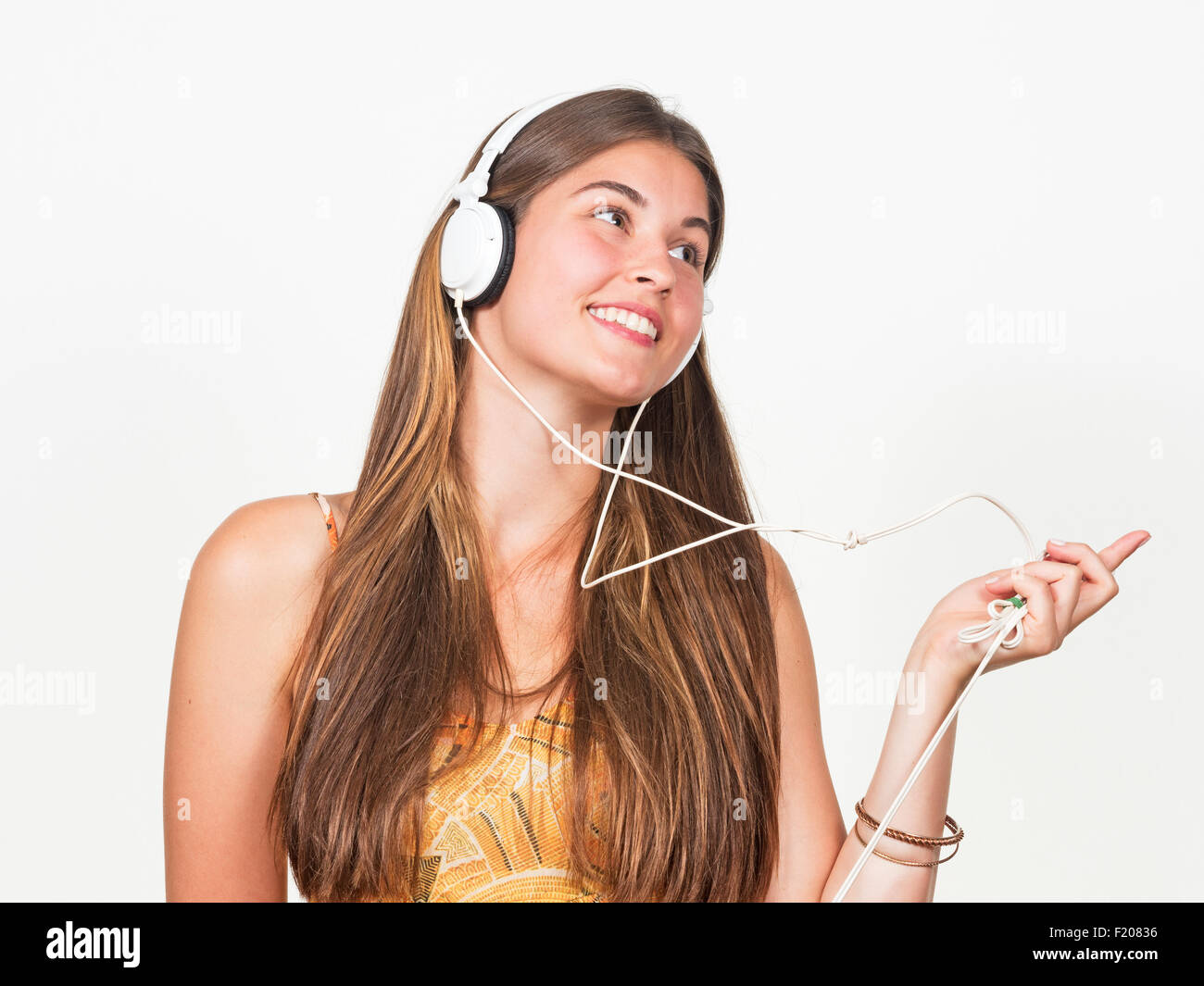 Junge Frau mit Kopfhörern Foto Stock
