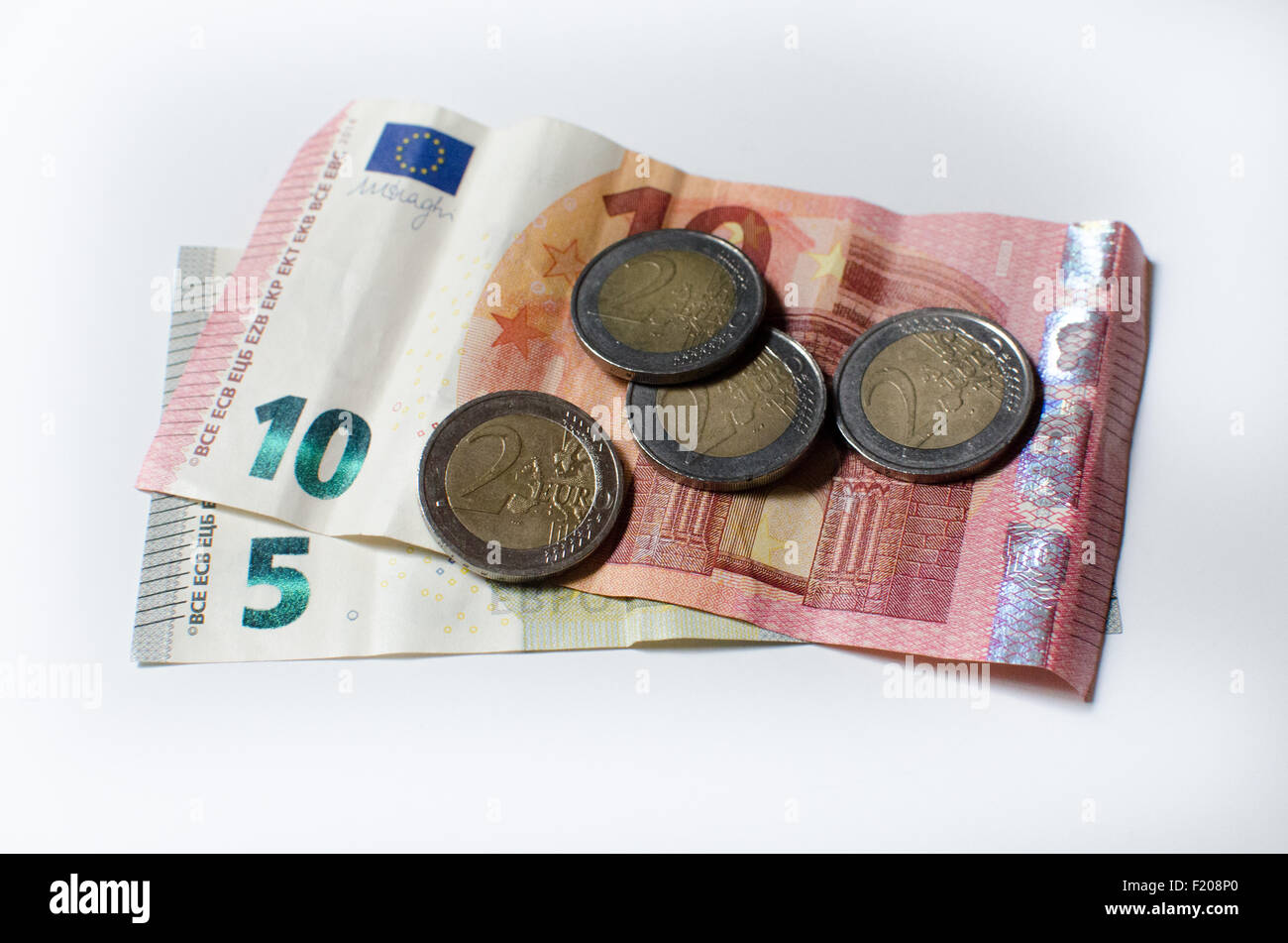 Monete e banconote di denaro in Europa Foto Stock