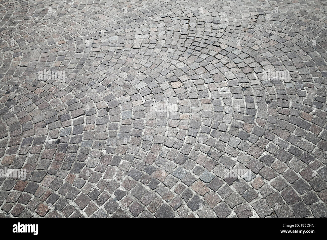 In ciottoli di granito di pavimentazione stradale. Foto di sfondo texture Foto Stock