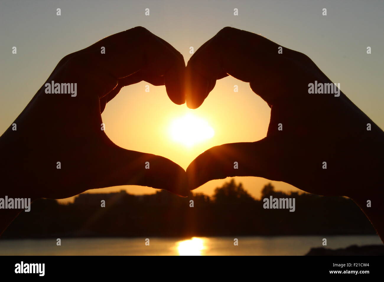 Sun all'interno del cuore Foto Stock