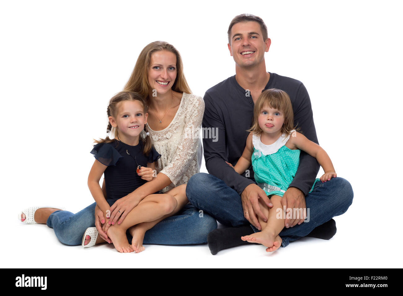 La famiglia felice. Padre, madre e figli. Su sfondo bianco. Foto Stock