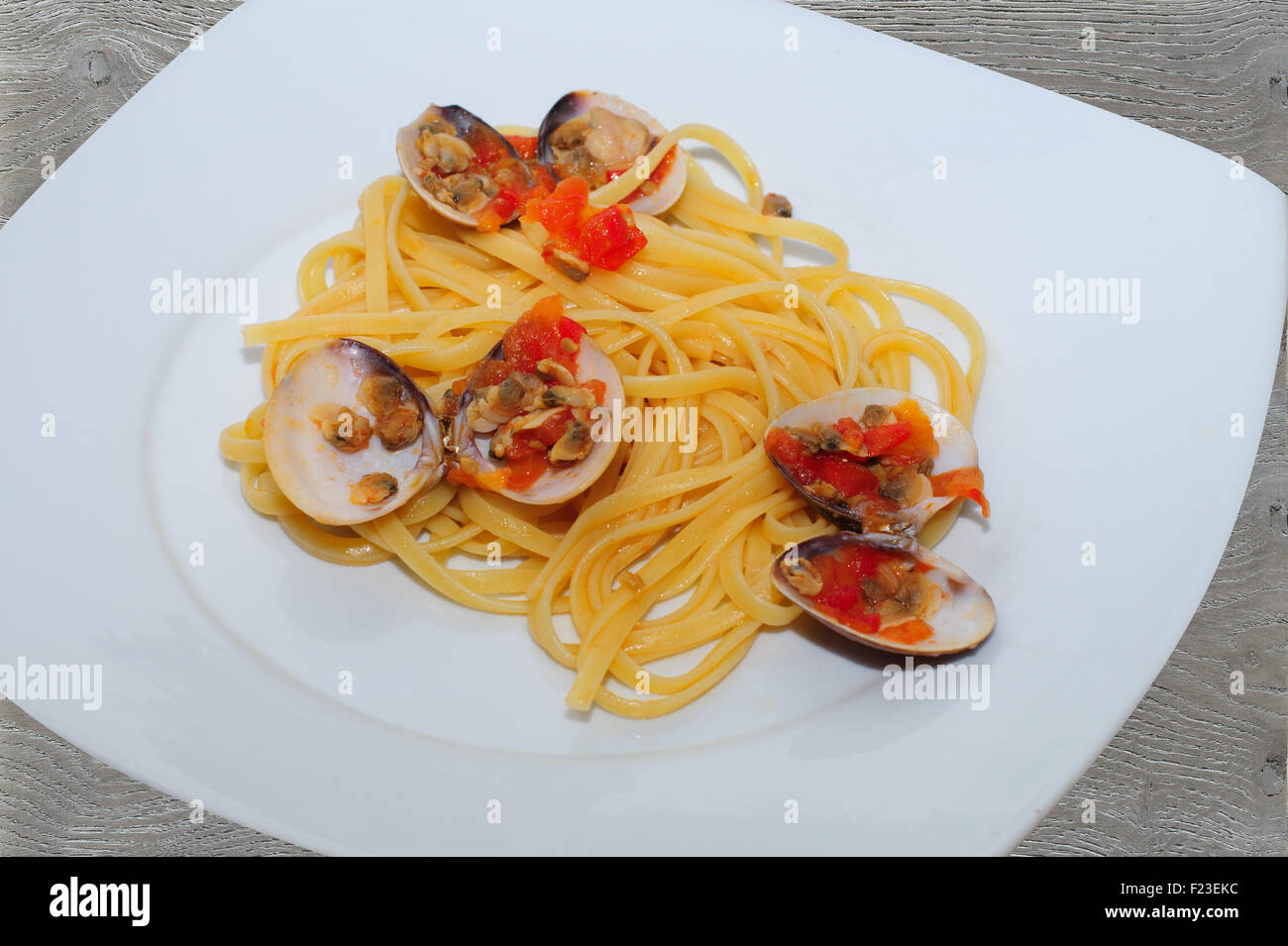 Italian spaghetti, la pasta italiana con pomodoro, pasta italiana con le cozze e le vongole, Foto Stock