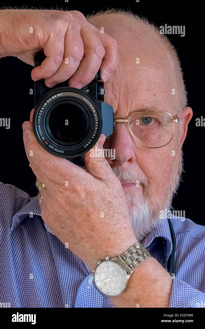 Fotografo con una telecamera Foto Stock