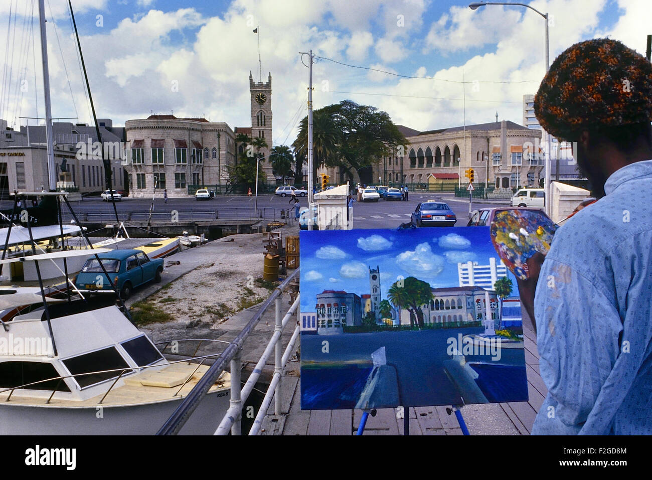 Local Bajan ammenda artista pittura del Palazzo del Parlamento. Bridgetown. Barbados. Caraibi Foto Stock