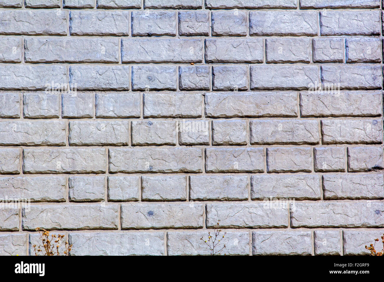 Il modello di pietra di un mattone parete di ritegno Foto Stock