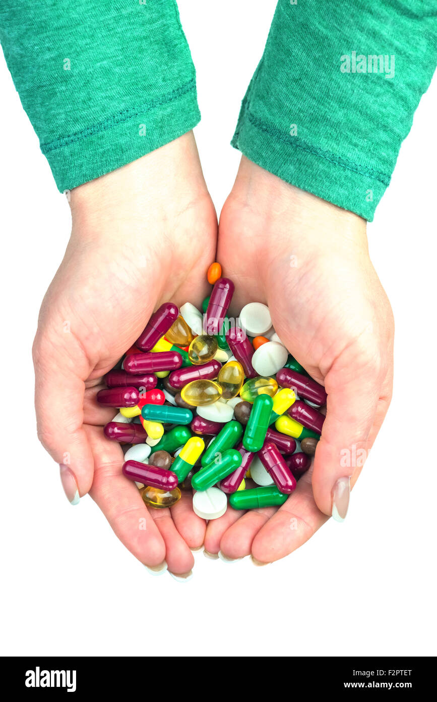 Molte pillole di colore nel lato isolato Foto Stock