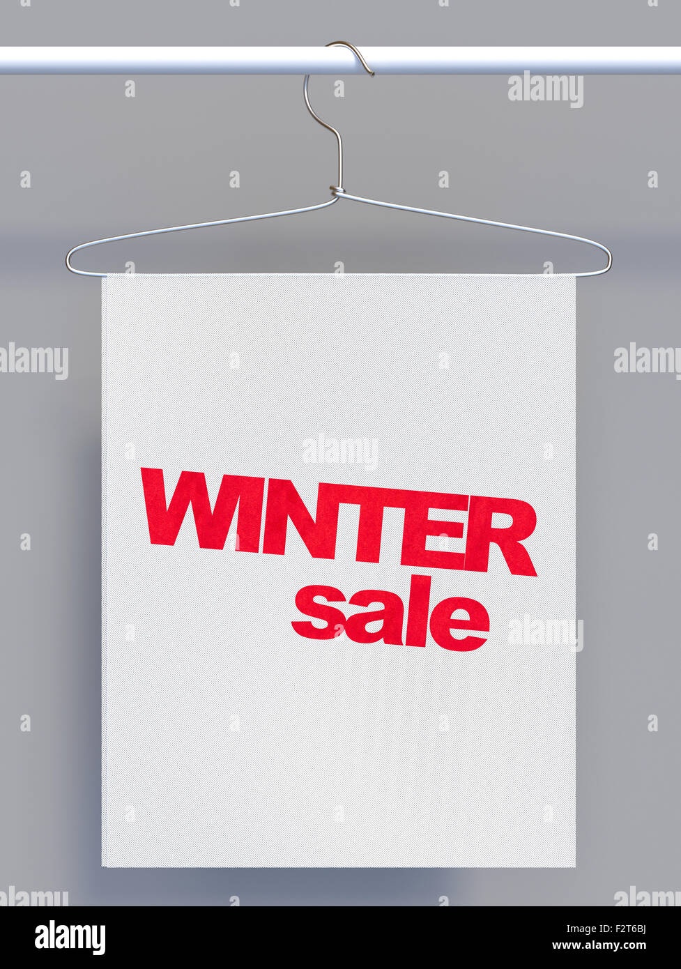 Staffa di filo sul bastone appendiabiti e banner con segno di vendita Foto Stock