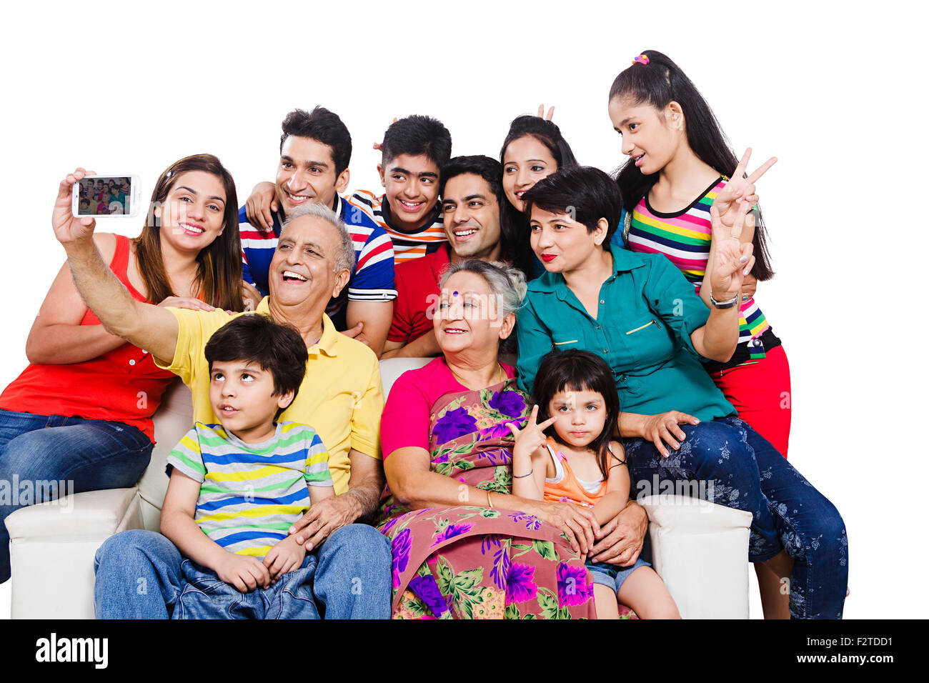 Gruppo indiano famiglia comune divano Mobile Phone Picture Self-portrait Foto Stock
