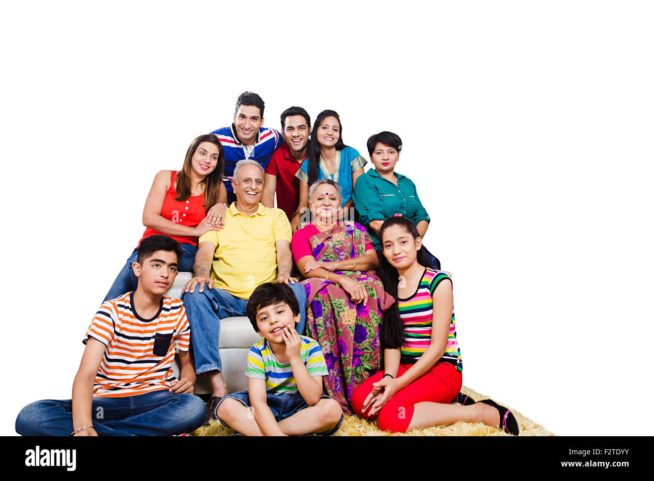 Gruppo indiano famiglia comune divano Foto Stock