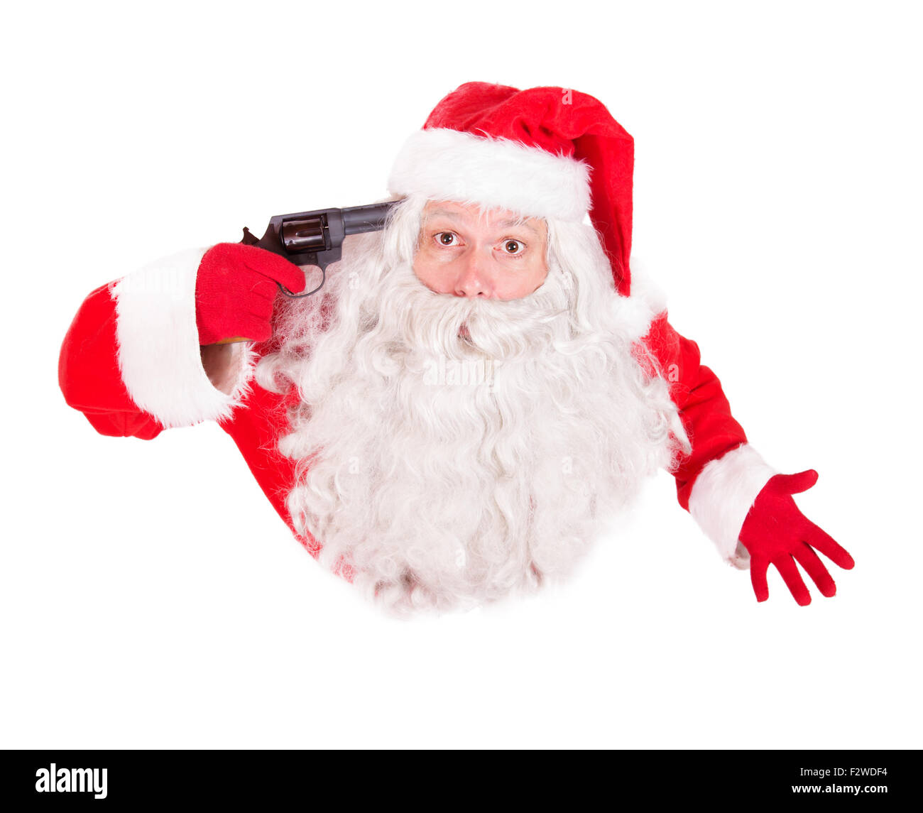 Santa Claus indicando una pistola alla sua testa e cercando fino alla telecamera Foto Stock