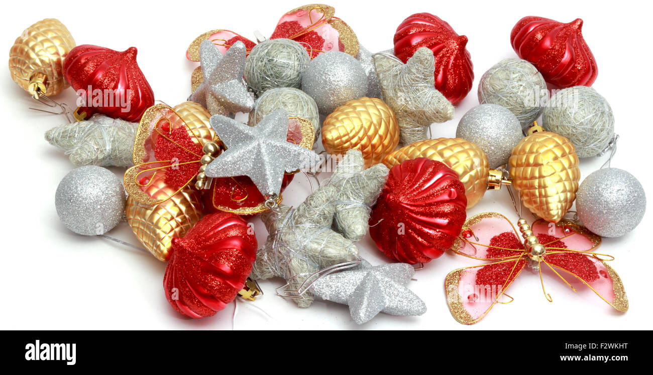 Addobbi natale, silver stars, golden pigne, sfere e lanterne rosse, colorata tinsel. Foto Stock