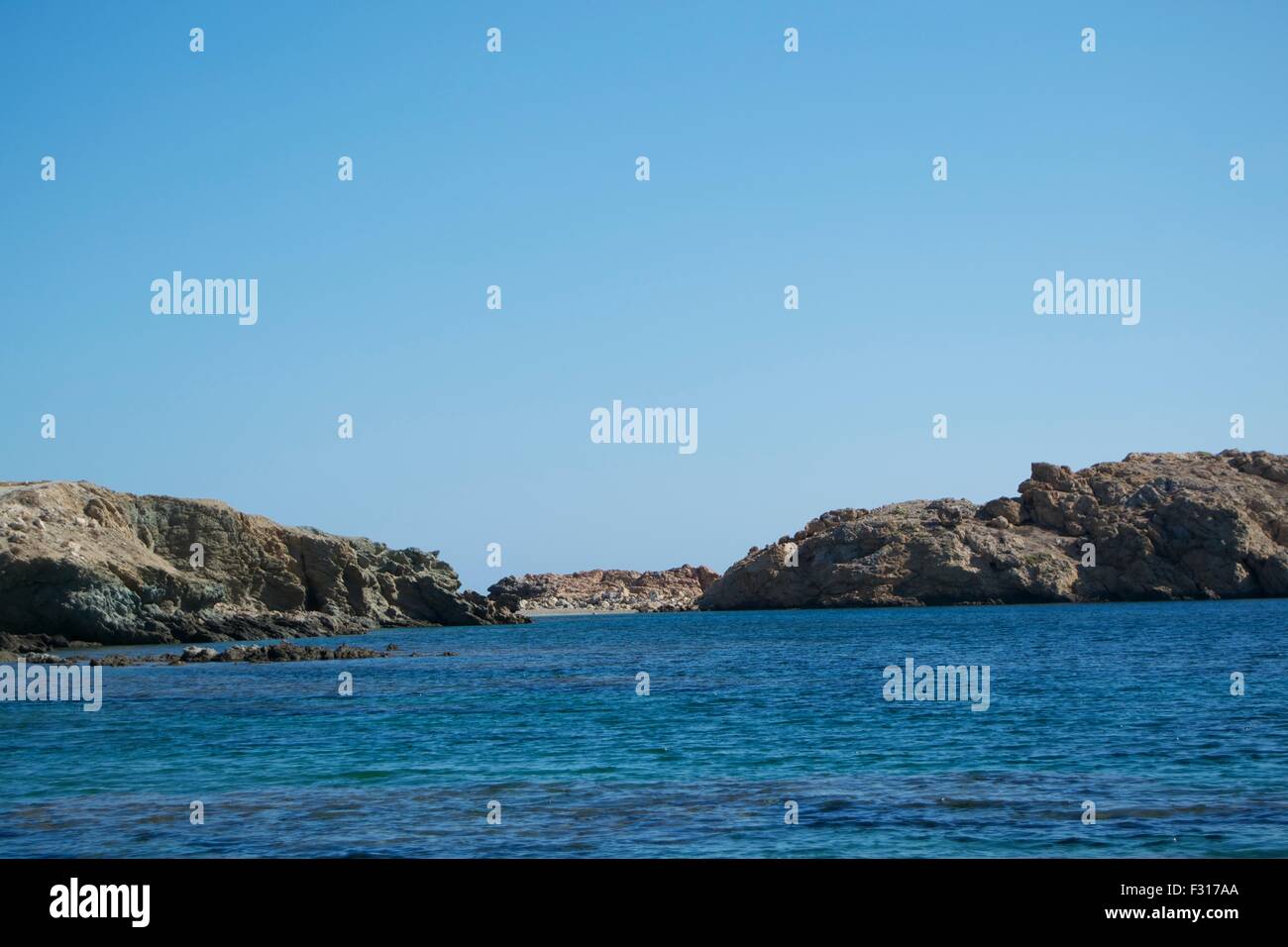 Spiaggia di isola di Mykonos Grecia azzurro acqua di mare Foto Stock