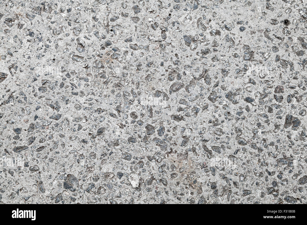 Seamless texture di sfondo di colore grigio scuro parete in calcestruzzo con ghiaia Foto Stock