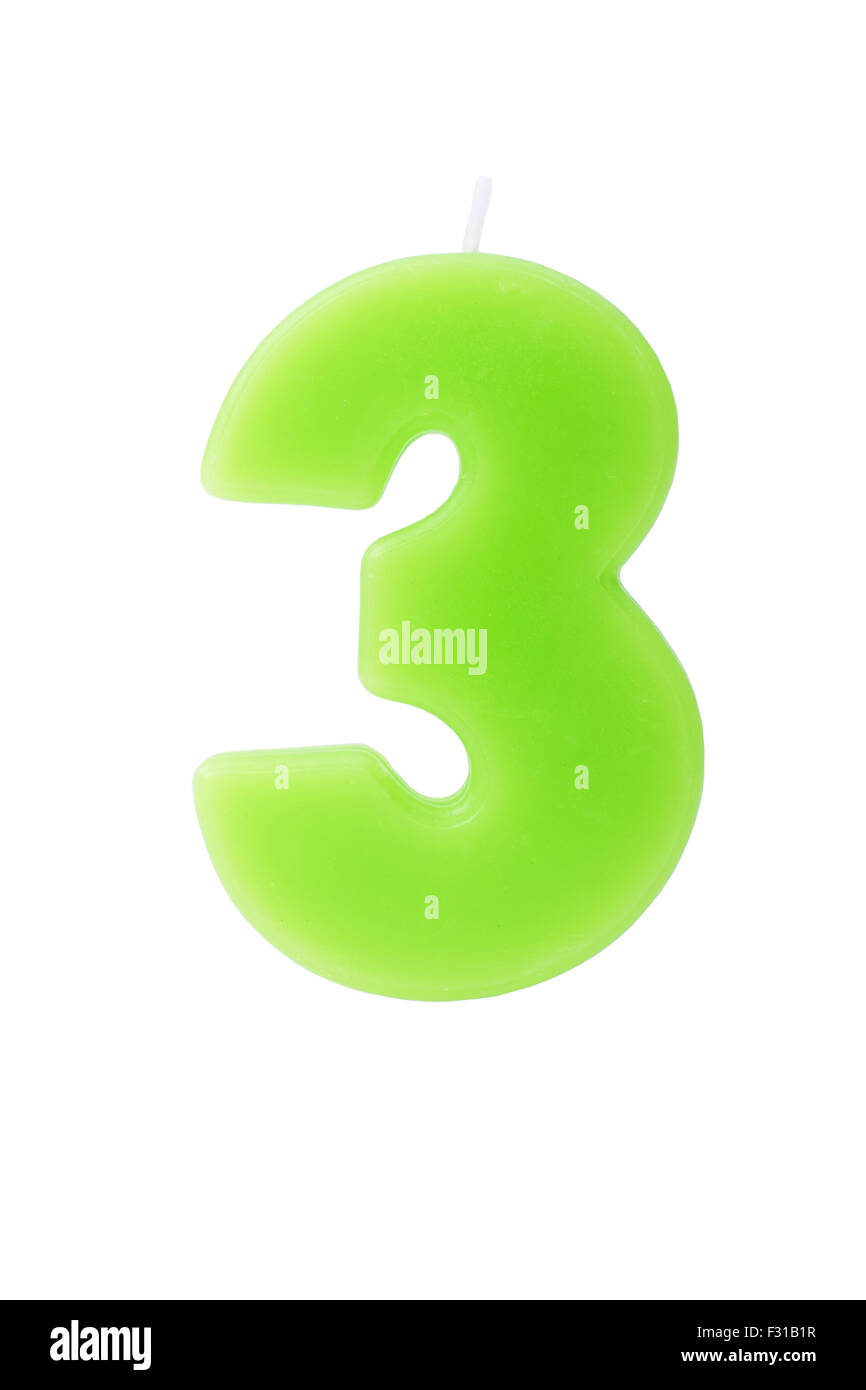 Verde candela di compleanno in forma di numero tre su sfondo bianco Foto Stock