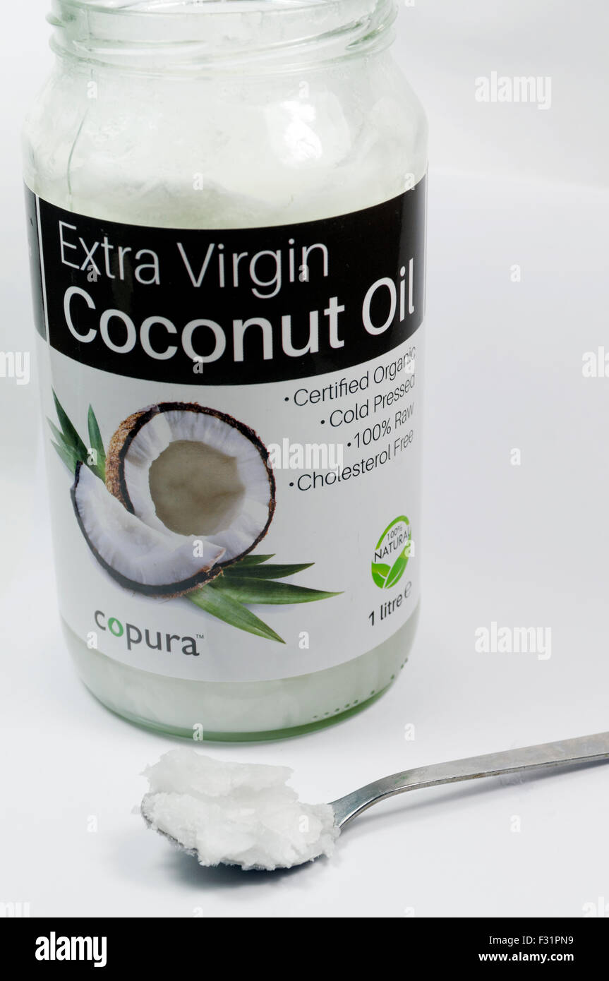 Materie vergine di olio di noce di cocco jar. Foto Stock