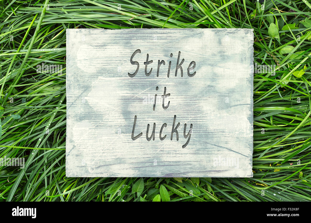 Vintage hipster frase motivazionale nota e colpire Lucky segno Foto Stock