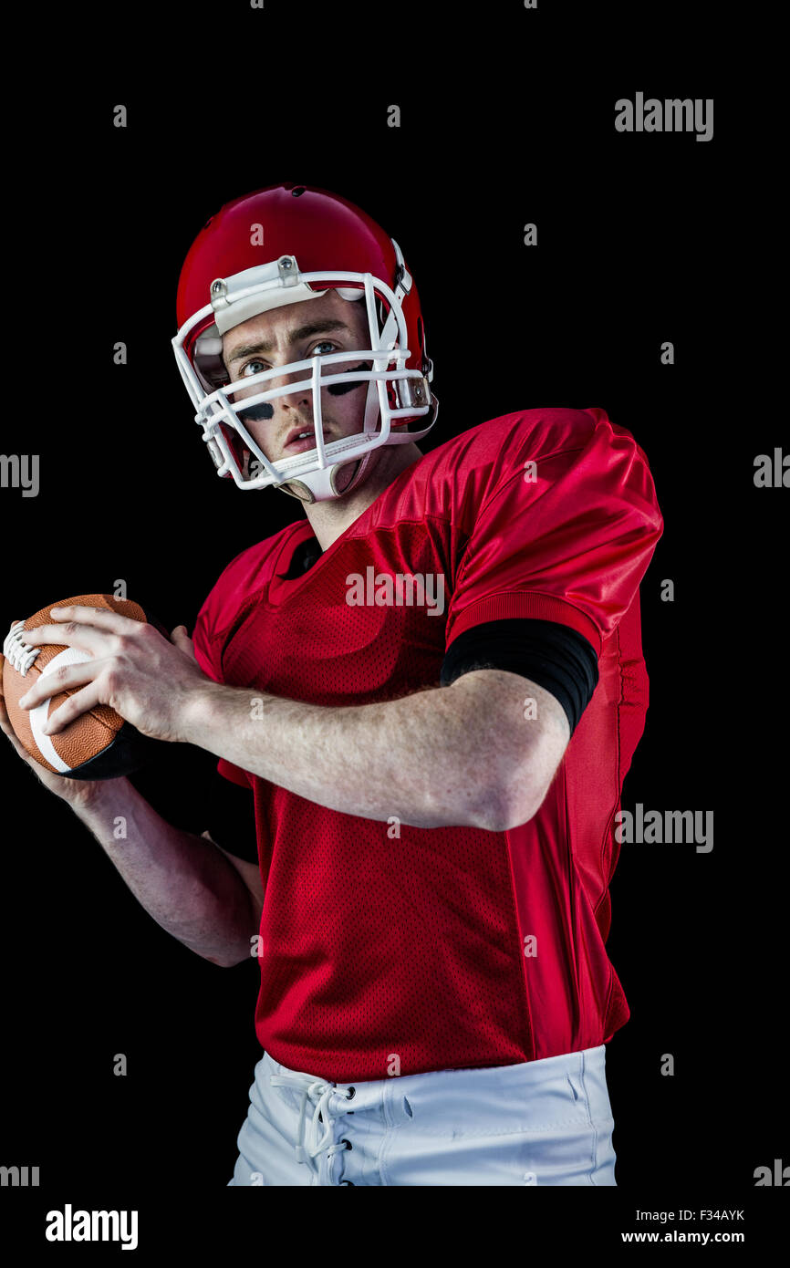 Ritratto di giocatore di football americano che stanno per lanciare il calcio Foto Stock