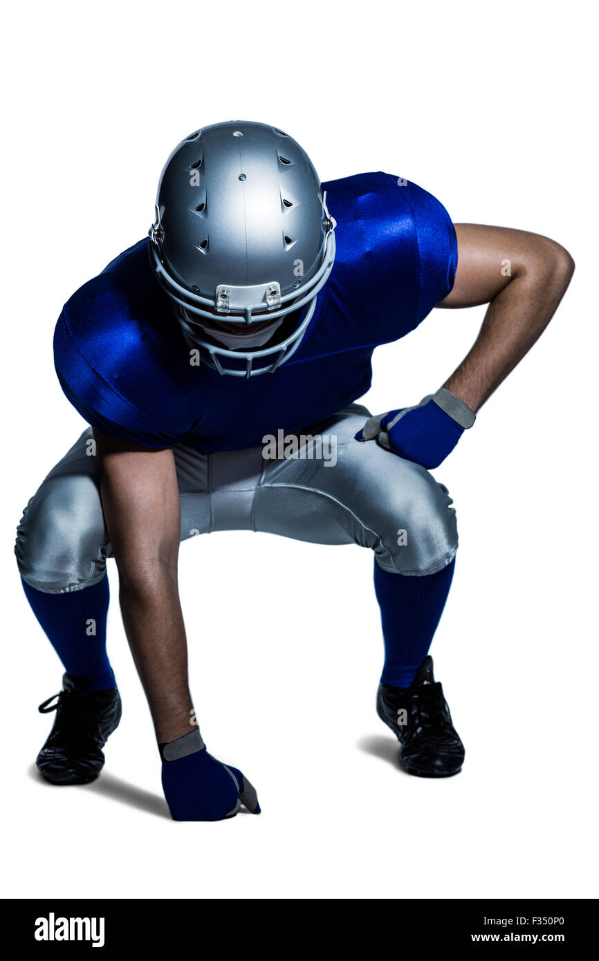 Giocatore di football americano in flessione uniforme Foto Stock