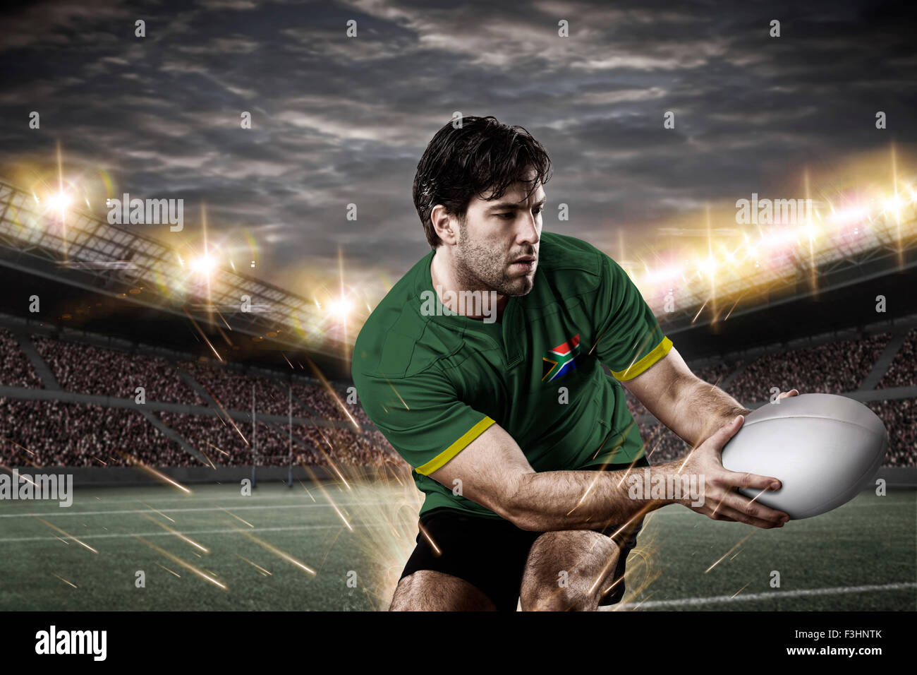 South African giocatore di rugby, indossando una verde e oro uniforme in uno stadio. Foto Stock