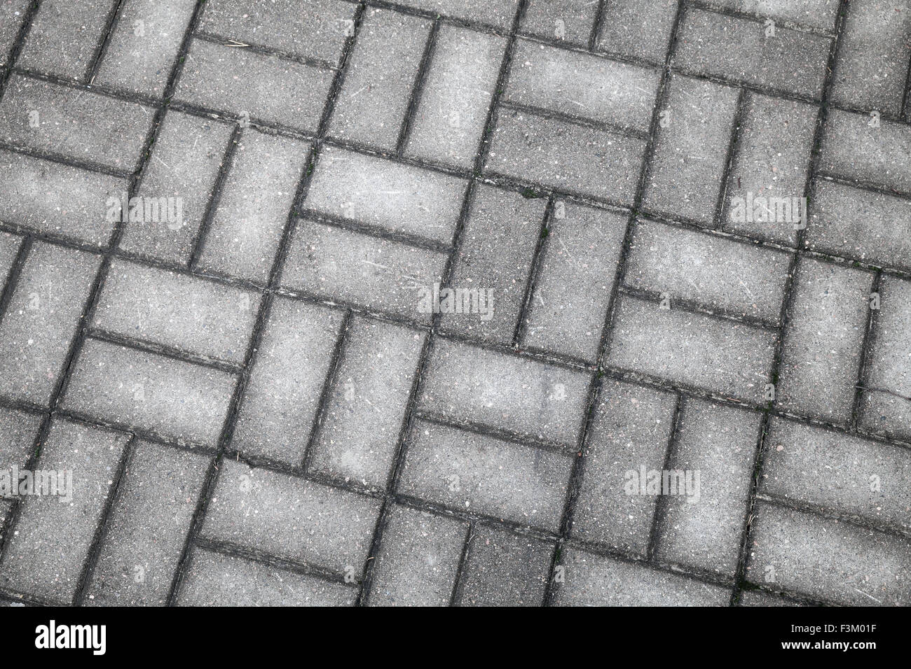 Vecchio grigio scuro wet cobblestone pavement, foto di sfondo texture Foto Stock