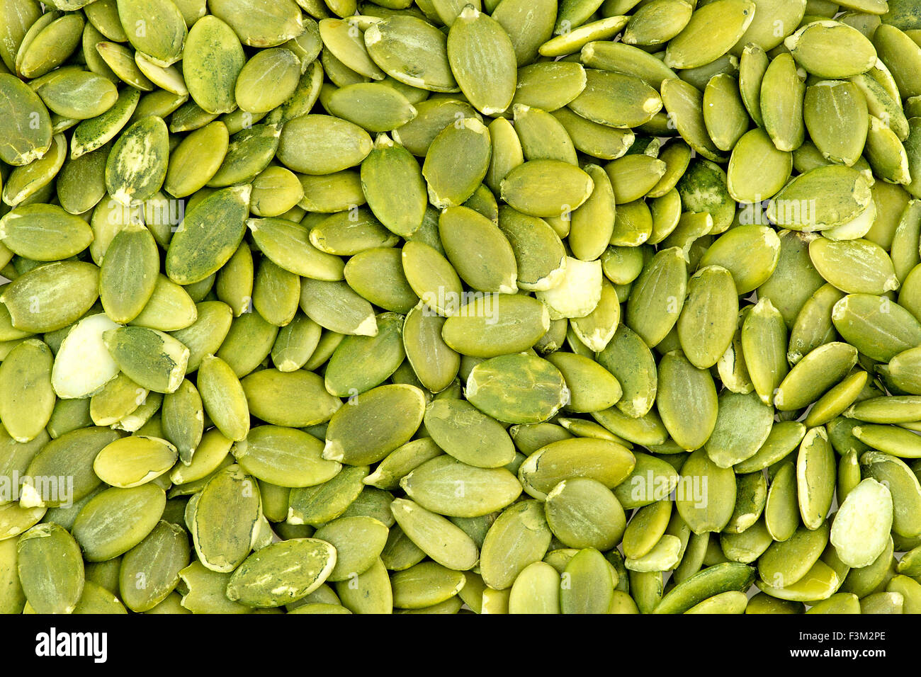 Macro texture di sfondo di verde i semi di zucca Foto Stock