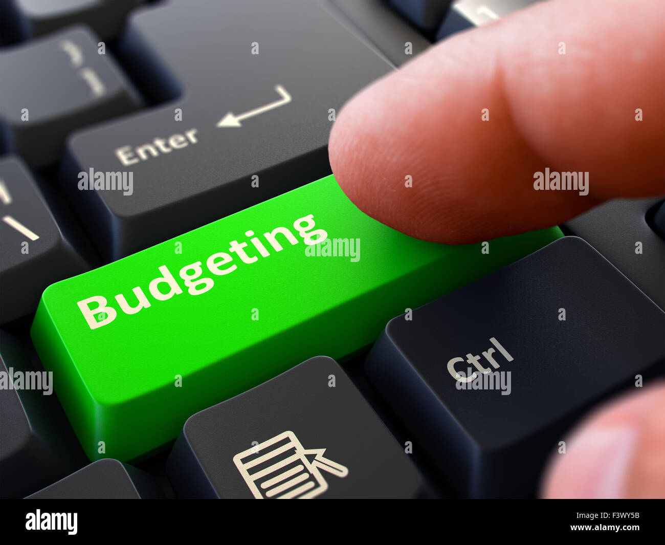 La pressione del dito verde pulsante Tastiera Budgeting. Foto Stock