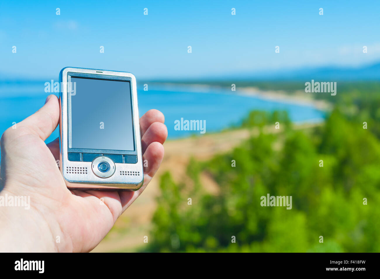 Dispositivo di navigazione GPS in mano Foto Stock