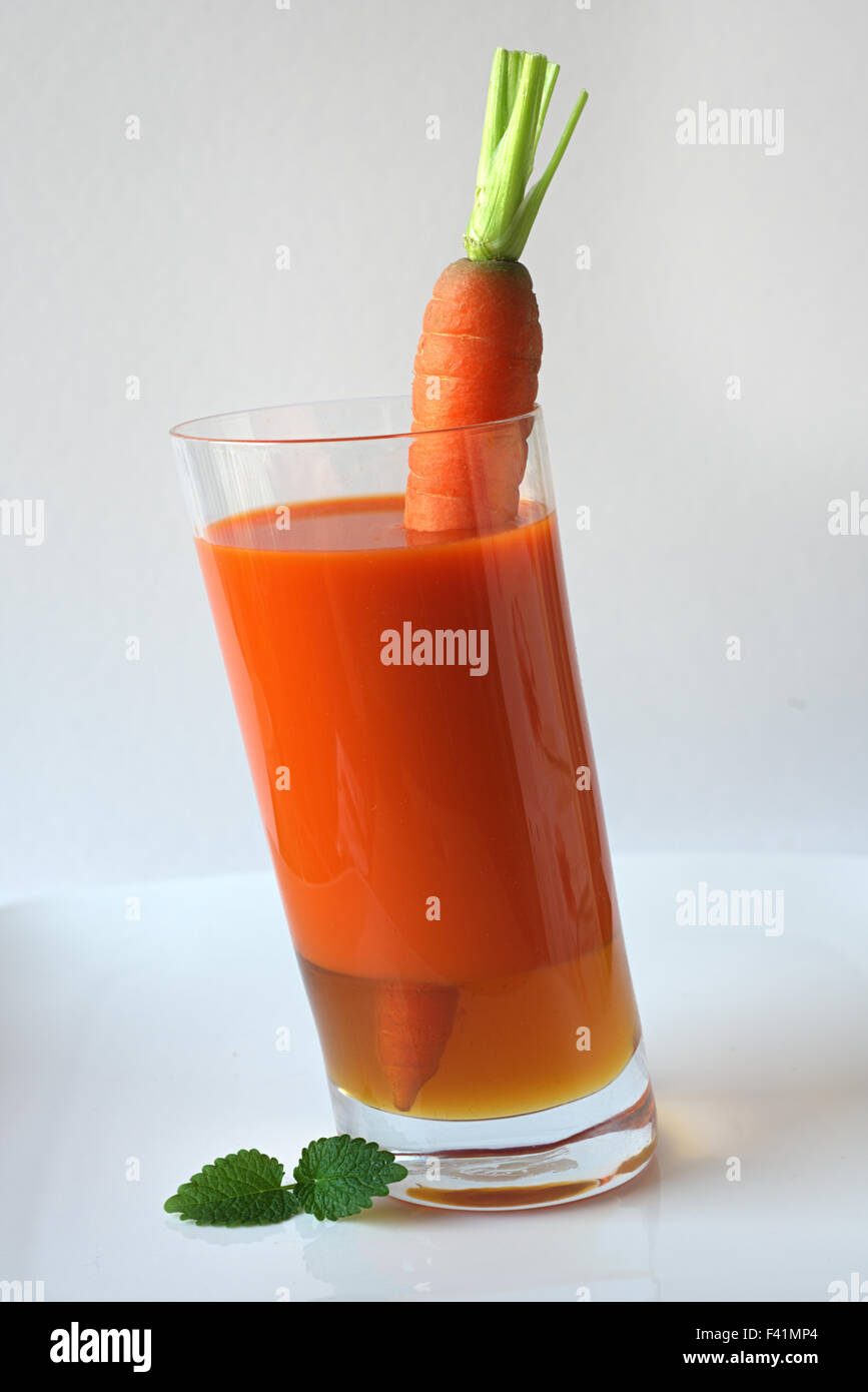 Succo di carota con miele Foto Stock