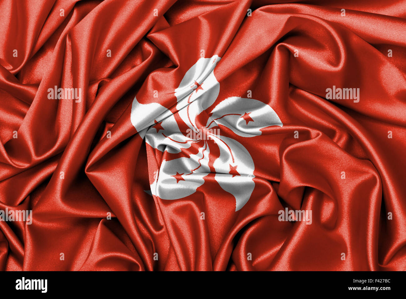 In raso grande bandiera sventola - bandiera di Hong Kong Foto Stock