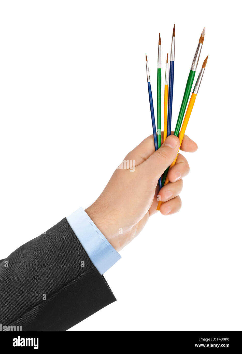 Mano con pennelli multicolore Foto Stock