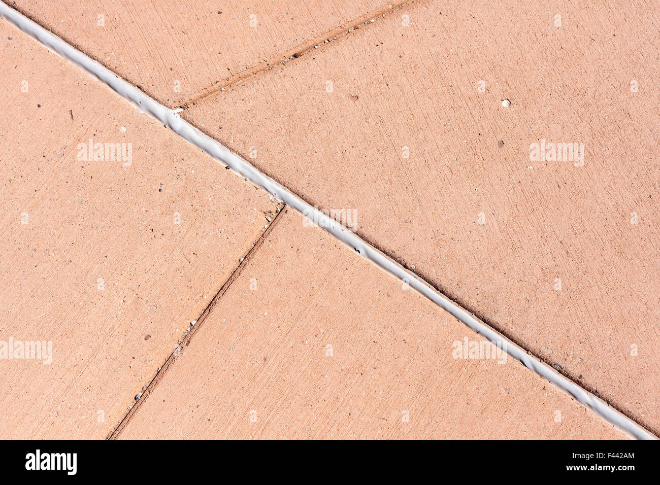 Sfondo costituito di pavimentazione in calcestruzzo con linee regolari. Foto Stock