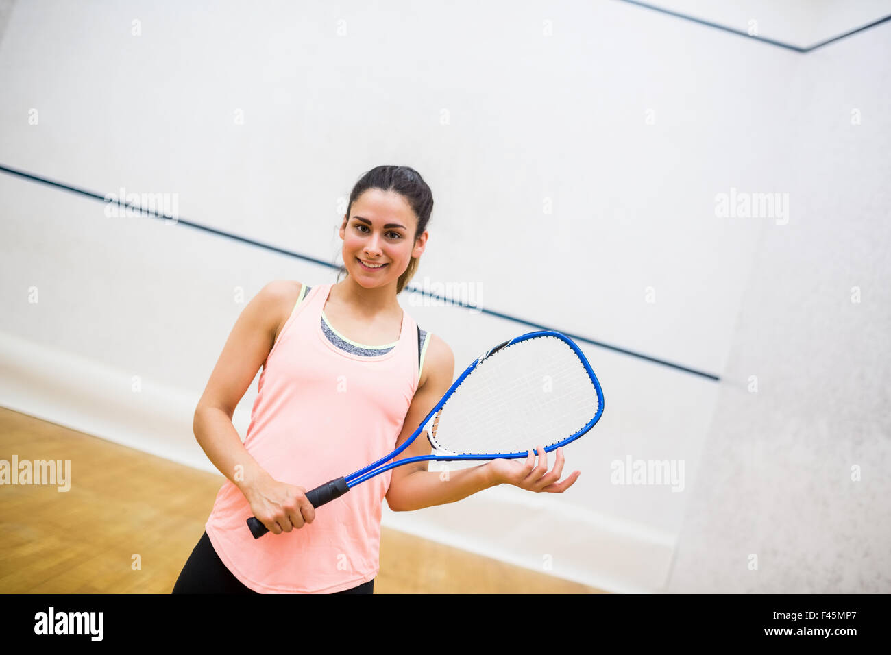 Donna desideroso di giocare a squash Foto Stock