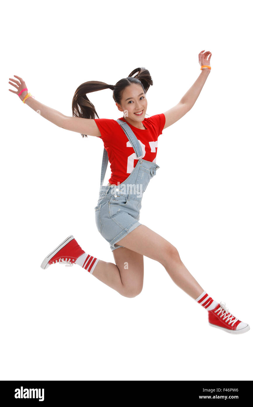 Felice giovane ragazza jump Foto Stock