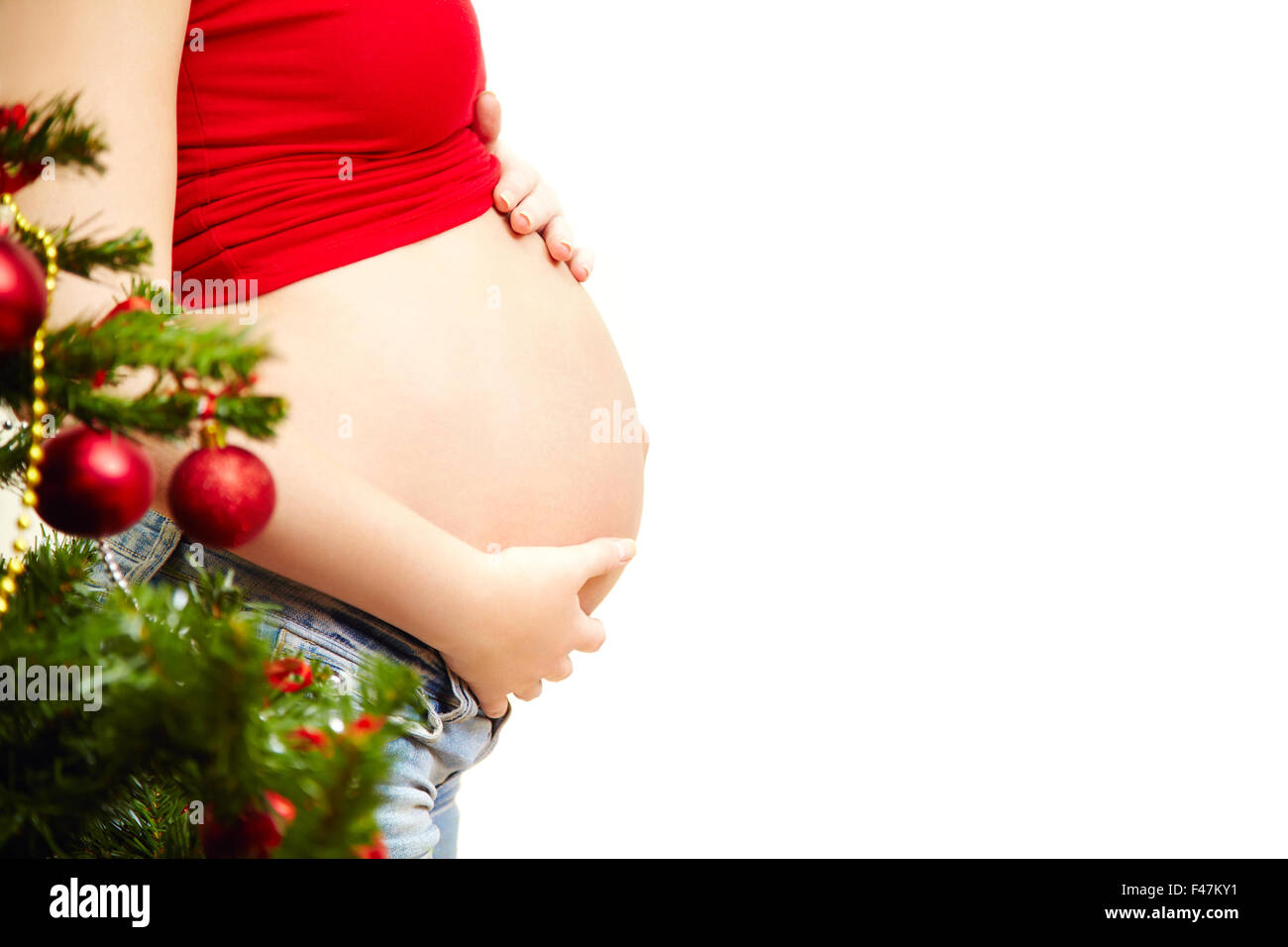 Donna incinta vicino all'albero di Natale Natale del popolo Foto Stock