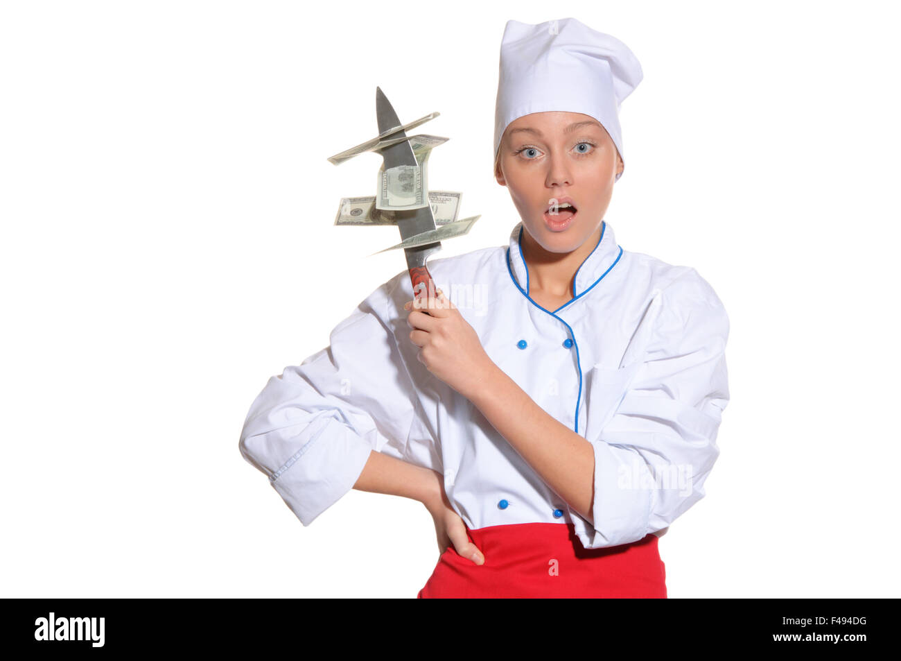 Sorpreso donna- chef con il coltello e il denaro Foto Stock