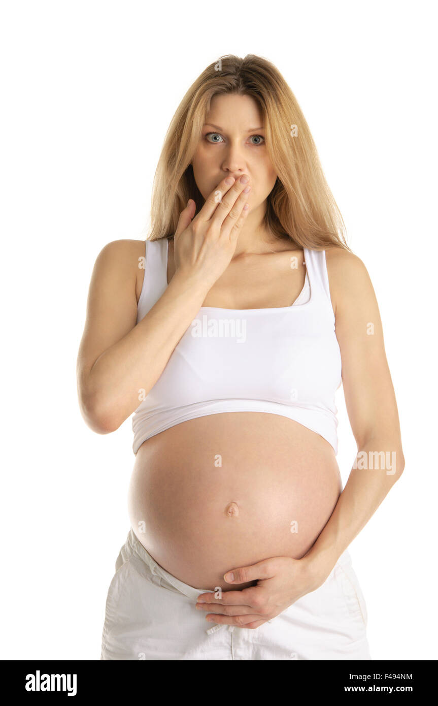 Sorpreso donna in stato di gravidanza Foto Stock