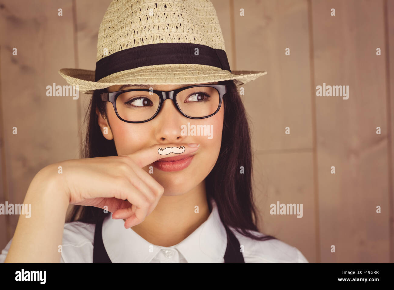 Hipster con i baffi sul dito Foto Stock
