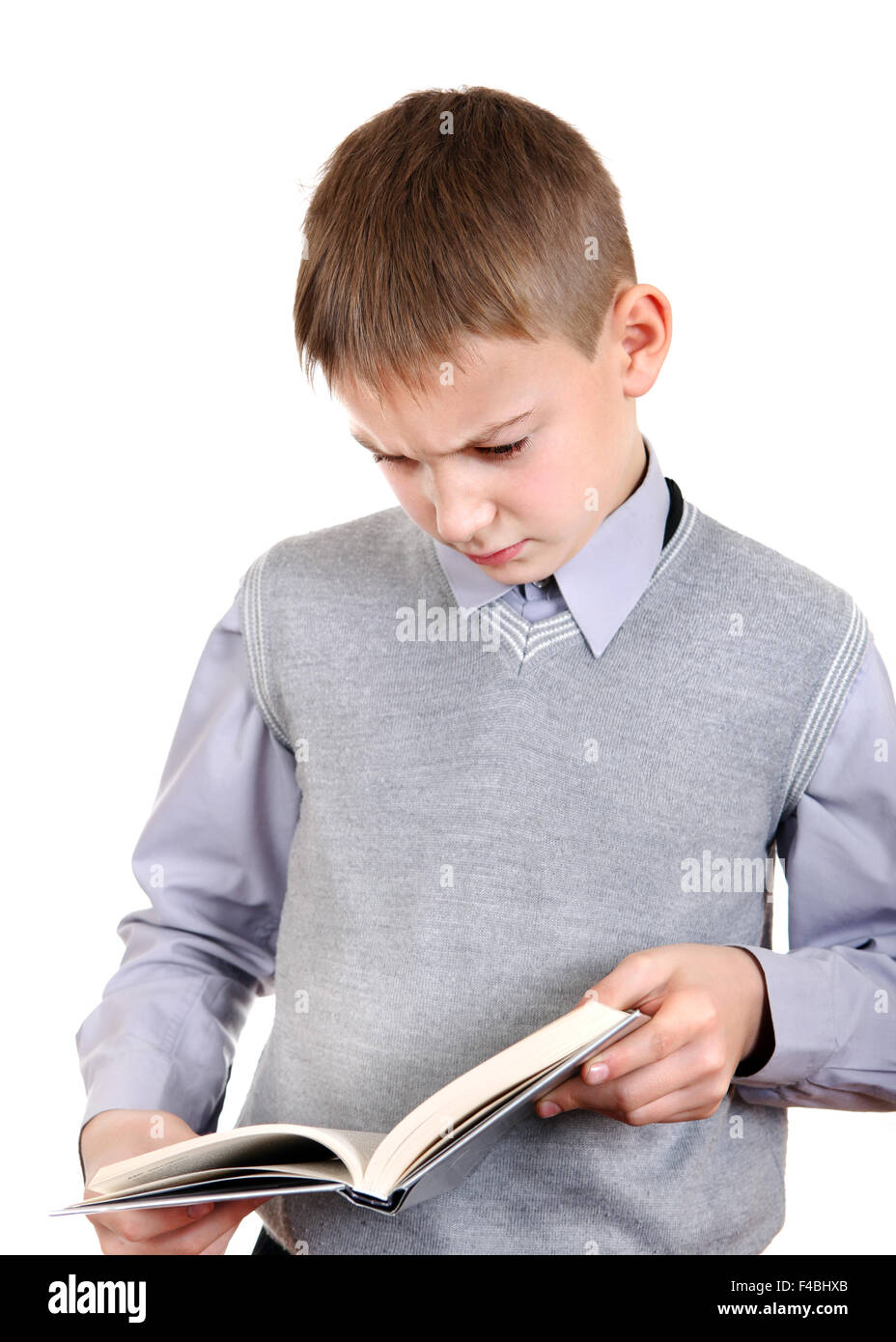 Infastiditi Kid con un libro Foto Stock