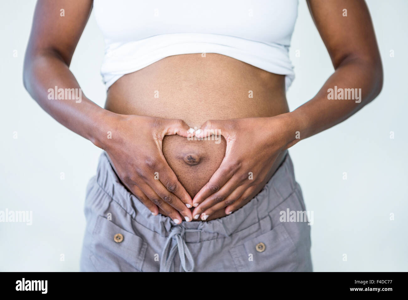 In prossimità di una donna in stato di gravidanza stomaco Foto Stock