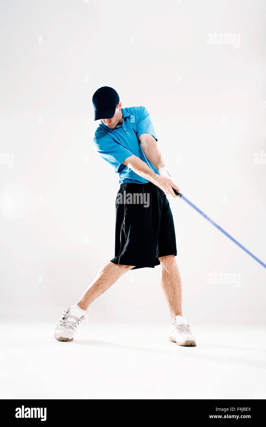 Uomo con un club di golf. Foto Stock