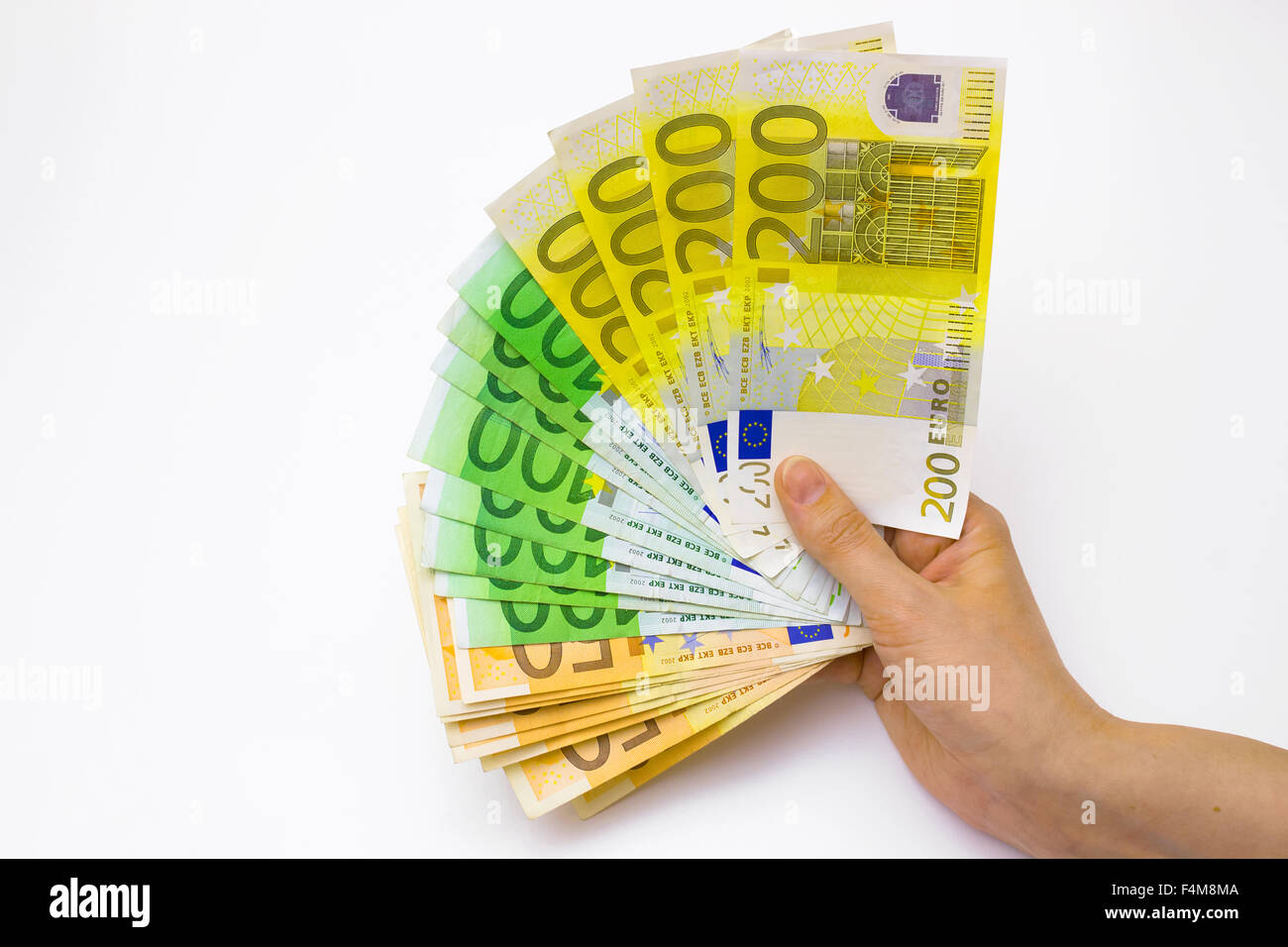 Un sacco di soldi in mano Foto Stock