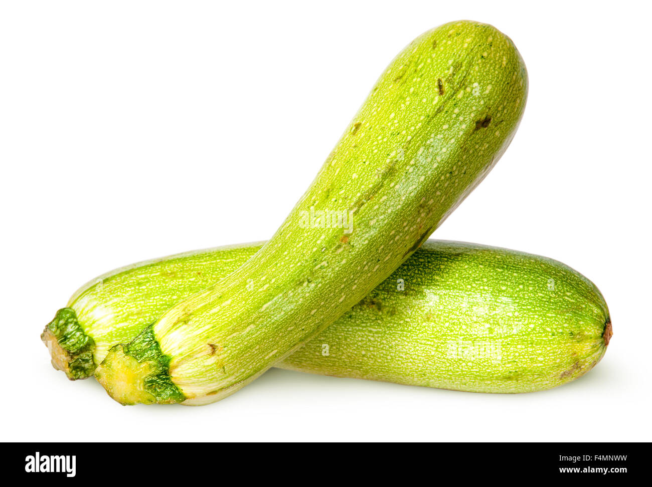 Due zucchine fresche si snodano isolati su sfondo bianco Foto Stock