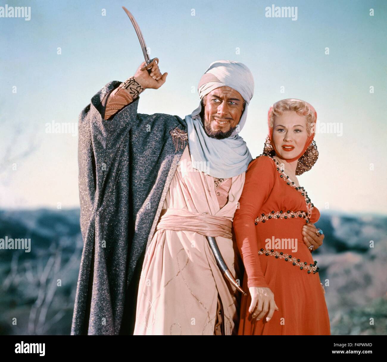 Rex Harrison e Virginia Mayo / re Richard e i crociati / 1954 diretto da David Butler [Warner Bros Foto] Foto Stock